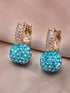 A pair of simple, elegant pendant earrings adorned with red rhinestones for women