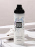 Makeup spray bottle with 'GECOMO' branding on a light background