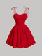 Red dress with thin straps on a gray background