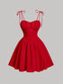 Red dress with thin straps on a gray background