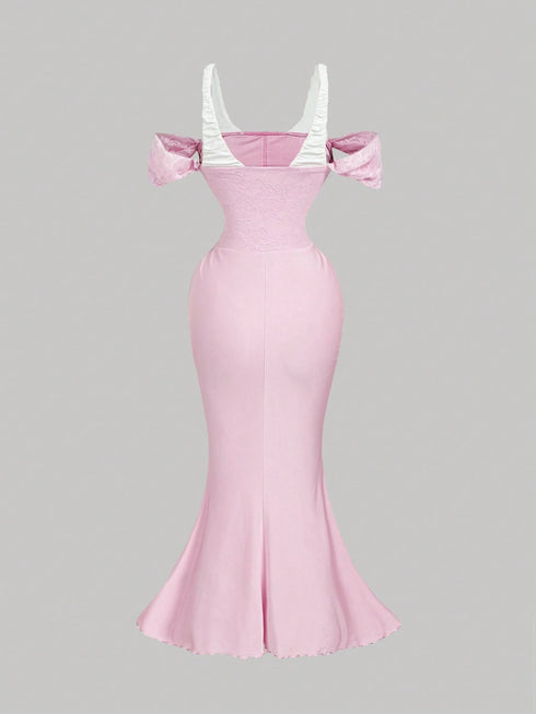 Pink evening gown with white top on a gray background