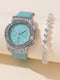 Turquoise watch with silver accents and a matching bracelet on a beige background