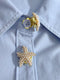 Pearl star-shaped button on a light blue shirt
