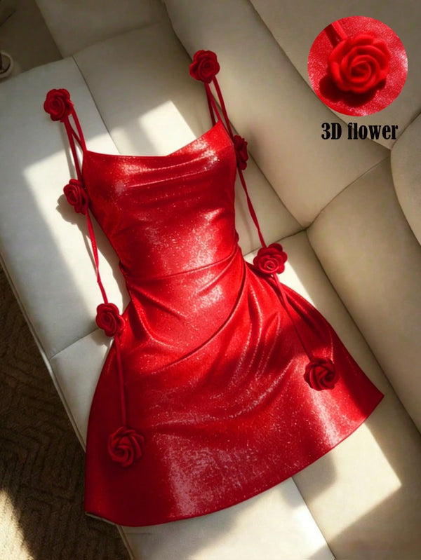 A bright red strapless mini dress with 3D rose embellishments on the straps, bodice, and skirt, displayed on a cream-colored leather sofa. A circular inset in the top right shows a close-up of the red rose detail with the text '3D flower'.