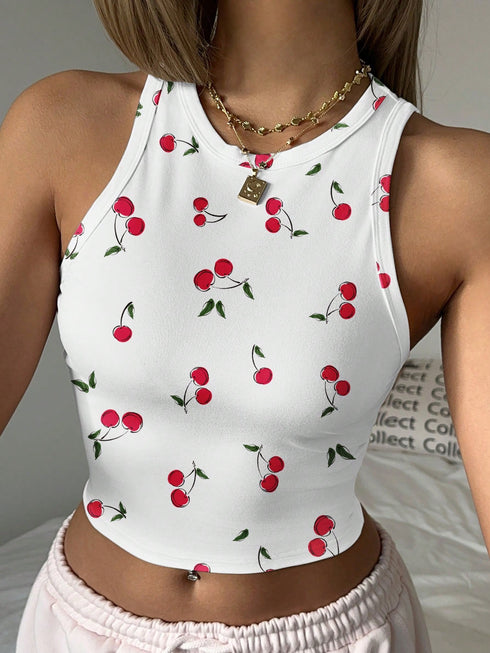 White sleeveless top with cherry pattern worn by a person