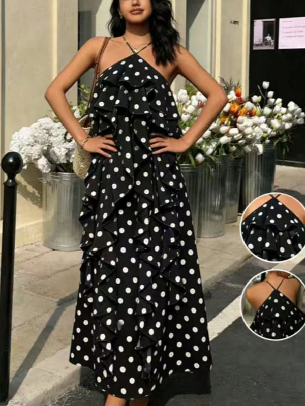 Woman wearing a black polka dot dress with a close-up inset of the dress.