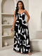Woman wearing a black and white patterned dress in an indoor setting.