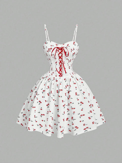 White dress with red floral pattern and lace-up front on a gray background