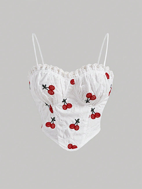 White lace top with cherry embroidery on a gray background