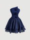 A navy blue one-shoulder dress with a structured corset-style bodice, three dimensional fabric roses on the front, and a layered ruffled skirt, shown against a light gray background.