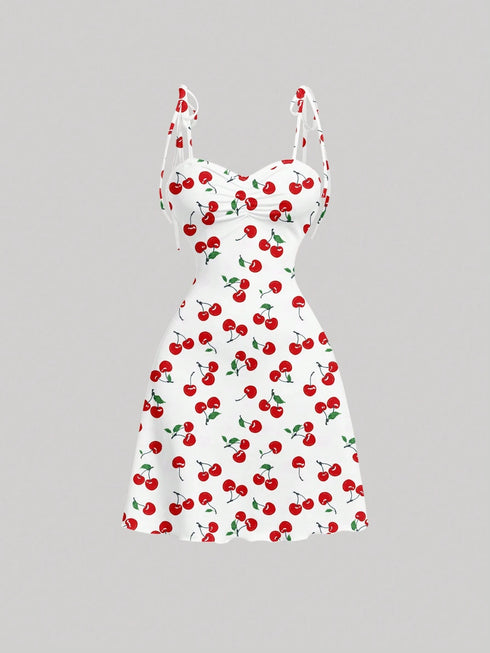 White dress with red cherry pattern on a gray background