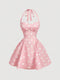 Pink dress with white polka dots on a light gray background