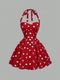 Red polka dot dress on a gray background