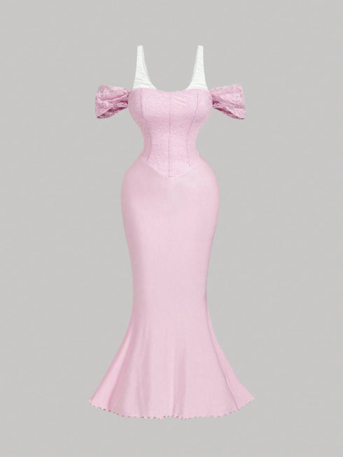 Pink evening gown with puff sleeves on a gray background