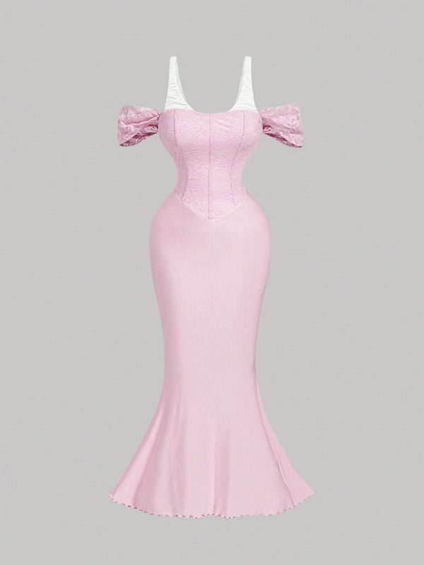 Pink evening gown with puff sleeves on a gray background