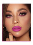 Close-up of a woman's face with bright pink lipstick and purple eyeshadow.