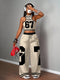 Woman wearing a stylish outfit with large numbers on a plain background