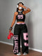 Person wearing a black and pink 'Los Angeles' outfit with headphones and a red bag.