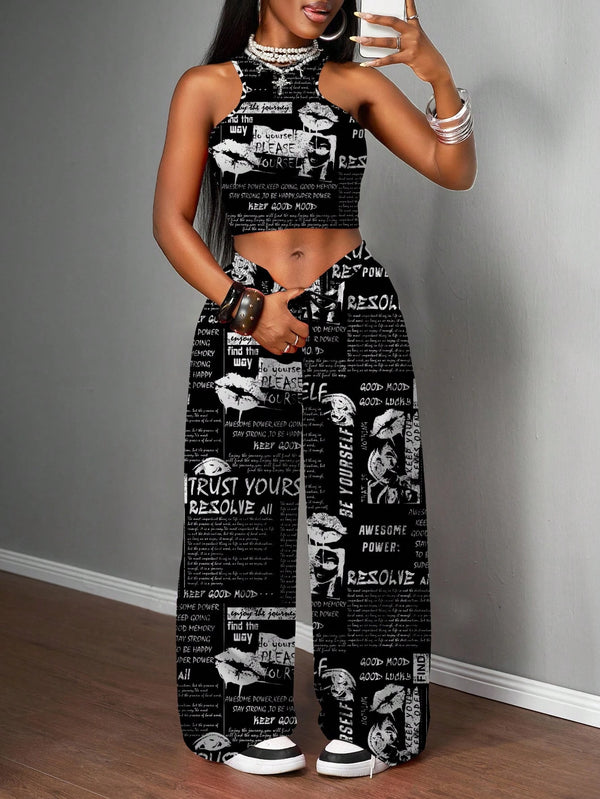 Woman wearing a black and white patterned outfit against a gray wall.