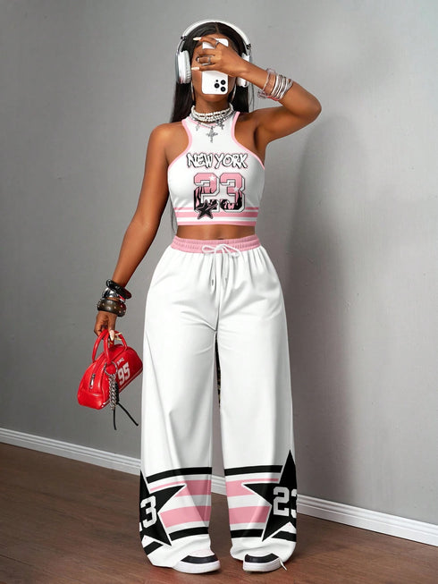 Person wearing a white and pink outfit with 'New York 23' design, holding a red bag.