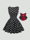 A sleeveless black and white polka dot swing dress with a red bow accent, shown on a light gray background with a circular inset highlighting the red bow.