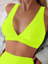 Neon green sports bra worn by a person