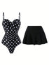 A two-piece swimsuit set featuring a black one-piece swimsuit with white polka dots and a solid black pleated mini skirt, displayed against a plain white background.