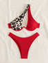 Red bikini with leopard print top on a light background
