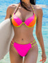 Woman wearing a colorful bikini with a blue water background