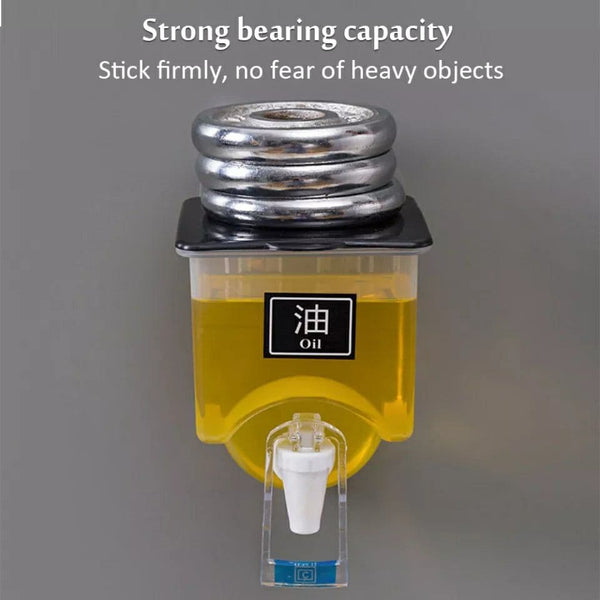 Yellow oil dispenser with metal weight on a gray background