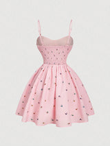 Pink dress with floral pattern on a light gray background