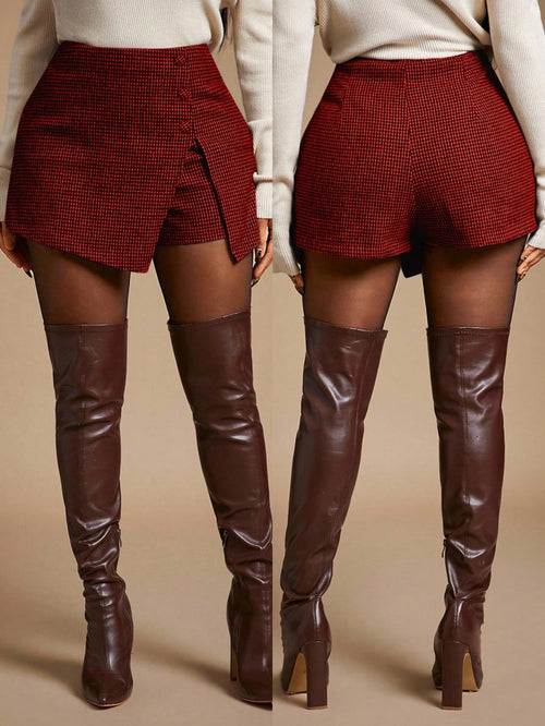 Two models shown from the back wearing high-waisted red and black micro-check patterned shorts and dark brown over-the-knee boots, set against a solid beige studio background.