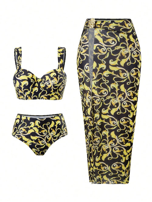 A three-piece swimwear set featuring a black and yellow baroque scroll pattern, including a bikini set on the left and a matching high-waisted wrap skirt on the right.