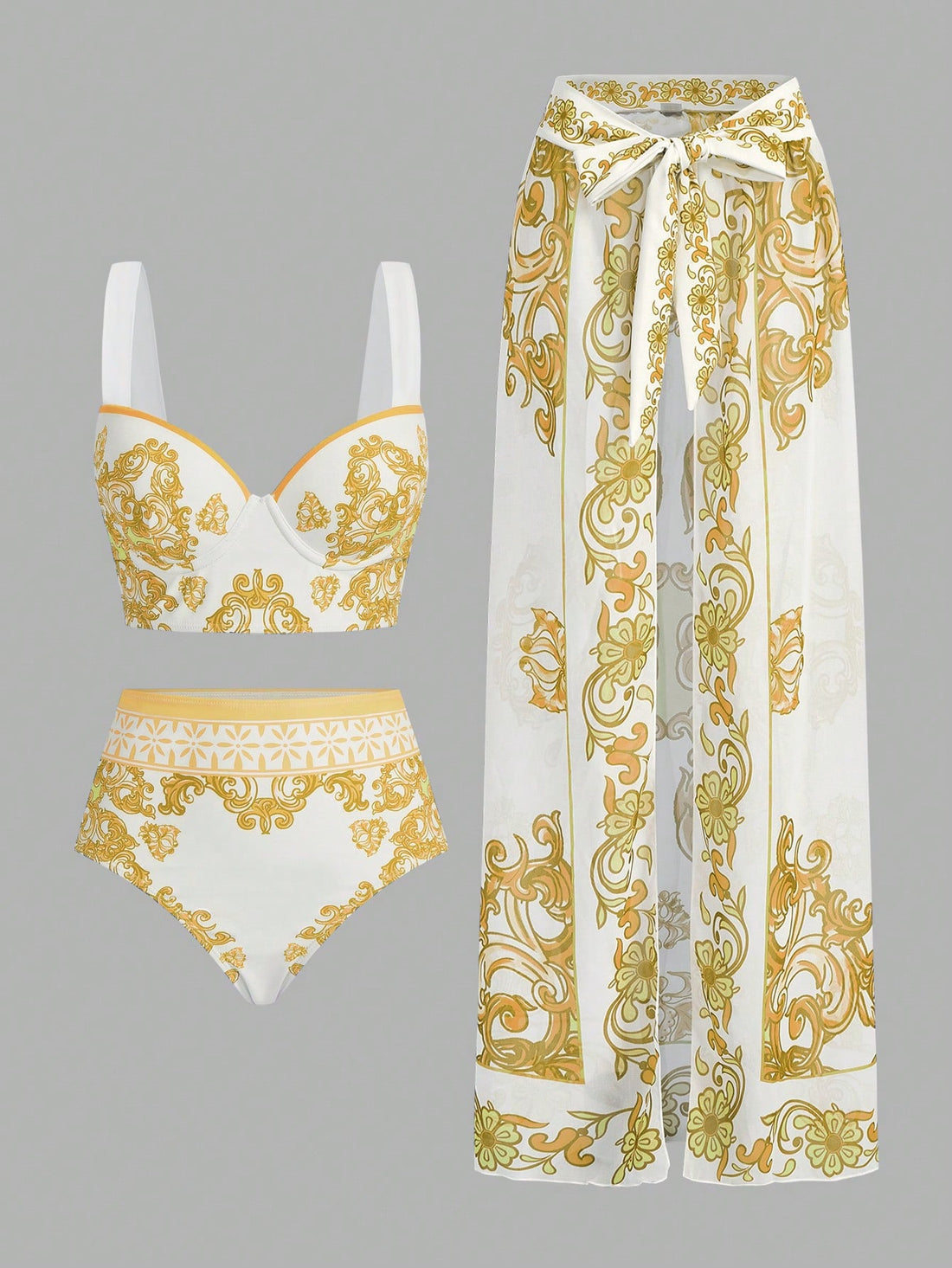 White and gold patterned bikini set with matching pants on a gray background